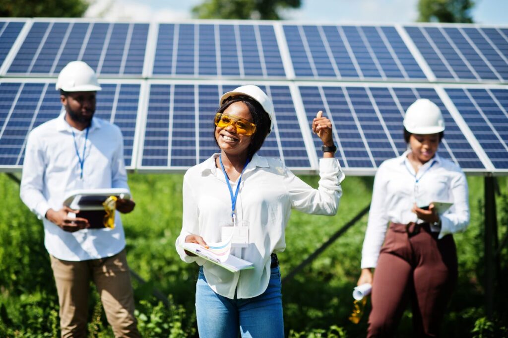 technician-checks-maintenance-solar-panels-group-three-black-engineers-meeting-solar-station